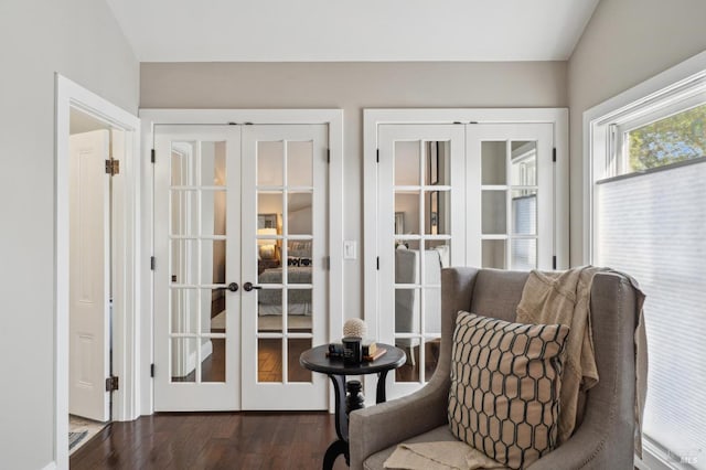 sitting room featuring wood finished floors and french doors