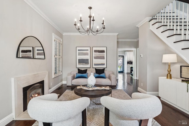 living area featuring a chandelier, crown molding, baseboards, a high end fireplace, and dark wood finished floors