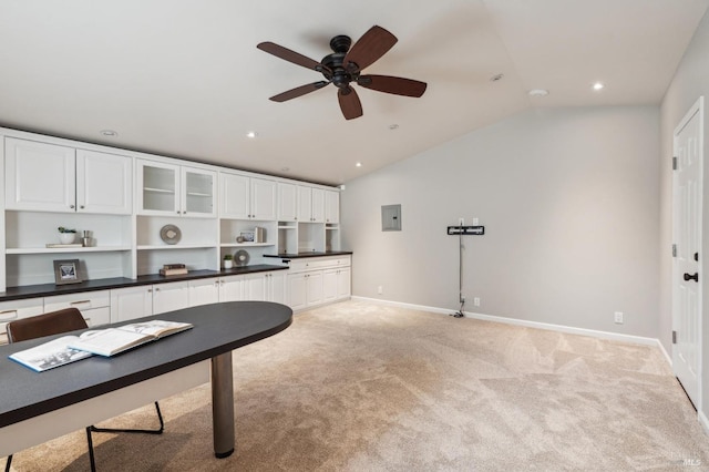 home office featuring recessed lighting, light colored carpet, vaulted ceiling, ceiling fan, and baseboards