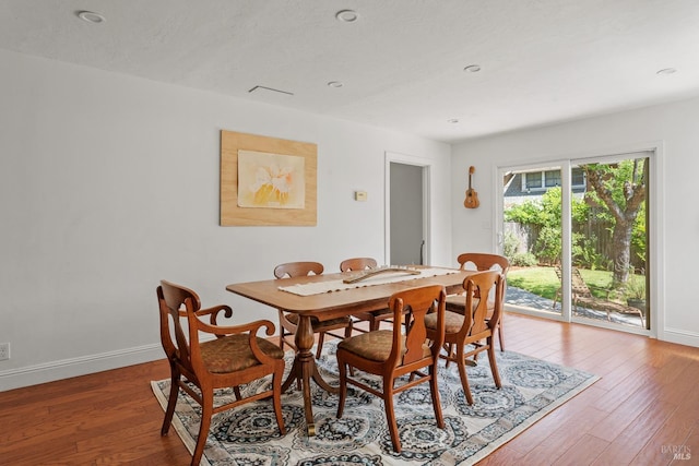 dining area with baseboards, recessed lighting, and light wood-style floors