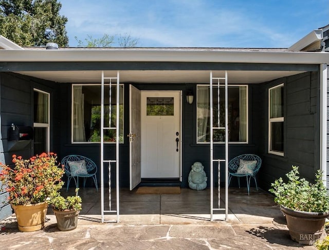 entrance to property with a porch