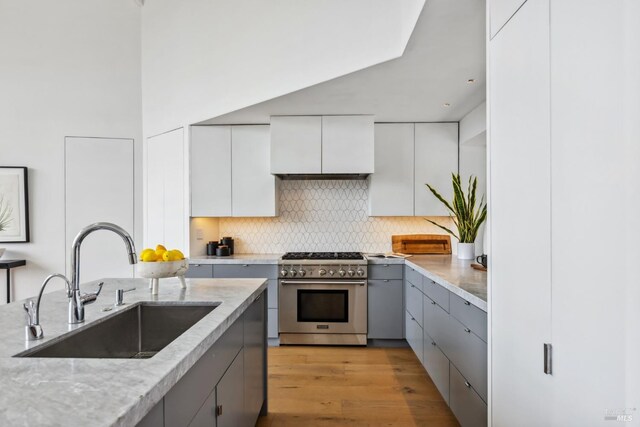 28 Timothy Ave, San Anselmo, CA 94960 - kitchen with stainless steel range, gray cabinetry, premium range hood, and decorative backsplash