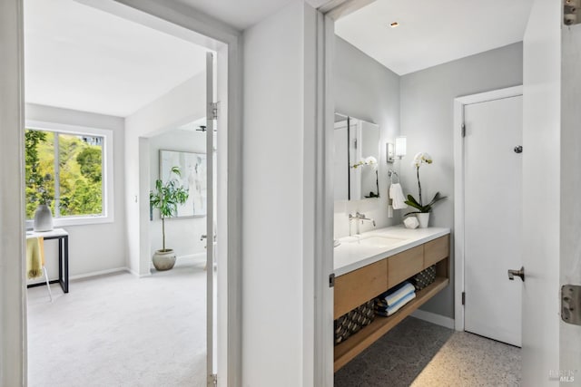 bathroom with vanity and baseboards