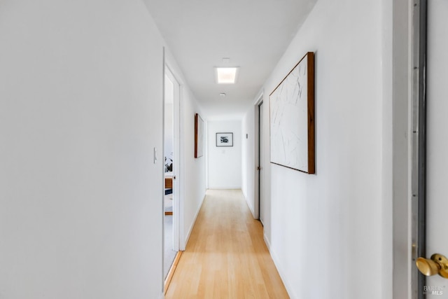 hallway featuring light wood-style floors