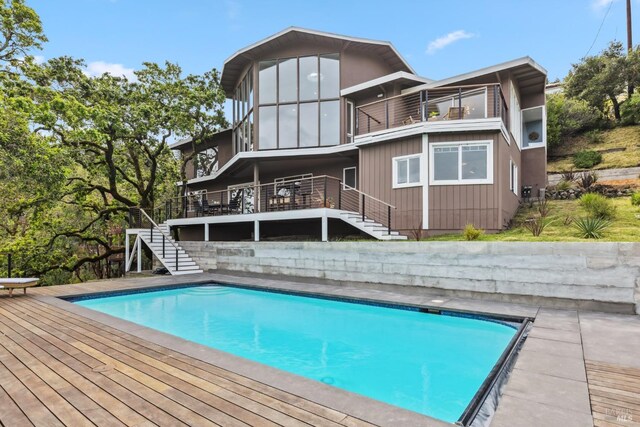 28 Timothy Ave, San Anselmo, CA 94960 - rear view of property with stairway, a balcony, an outdoor pool, and a deck