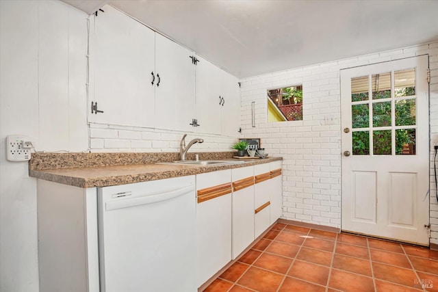 337 Madrone Ave, Larkspur, CA 94939 - kitchen featuring white dishwasher, a sink, white cabinetry, tile patterned floors, and brick wall