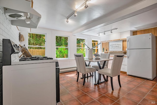 337 Madrone Ave, Larkspur, CA 94939 - dining area featuring rail lighting, baseboard heating, and dark tile patterned flooring