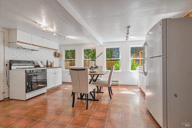 337 Madrone Ave, Larkspur, CA 94939 - tiled dining room with rail lighting and a baseboard radiator