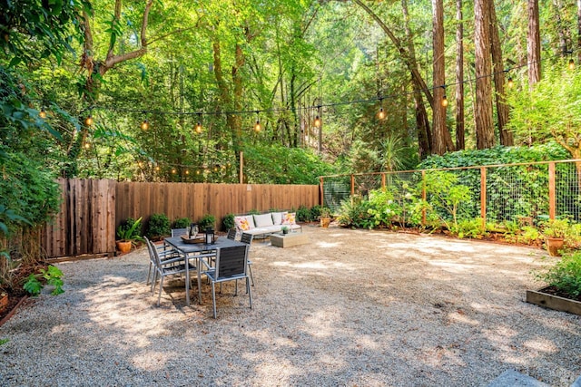 337 Madrone Ave, Larkspur, CA 94939 - fenced backyard featuring an outdoor hangout area, a wooded view, and a patio