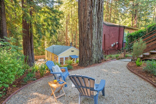 337 Madrone Ave, Larkspur, CA 94939 - view of yard featuring a patio and a wooded view