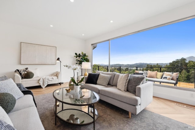 living room with recessed lighting and a mountain view
