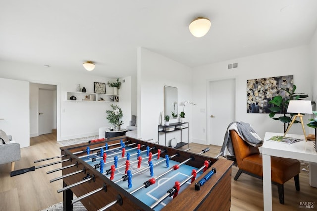 rec room with visible vents and light wood finished floors