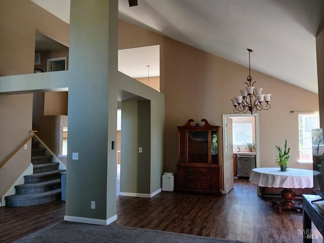 2998 Burl Ct, Fairfield, CA 94533 - dining area featuring high vaulted ceiling, dark wood-style floors, a chandelier, and stairway