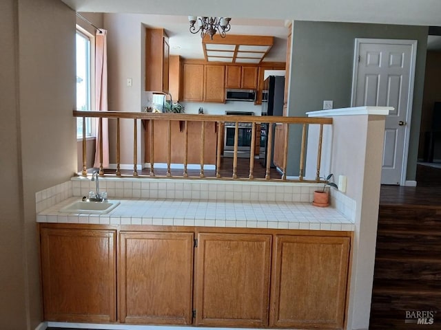 2998 Burl Ct, Fairfield, CA 94533 - kitchen featuring stainless steel microwave, stove, a sink, and tile counters
