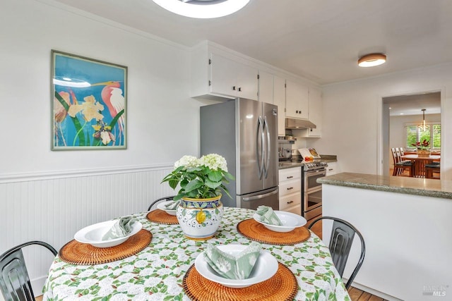 dining area with wainscoting