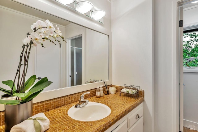 bathroom with vanity and decorative backsplash