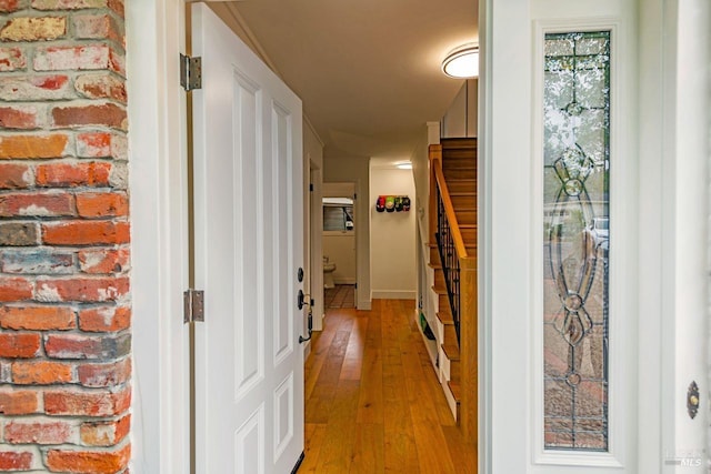 hallway featuring stairs and light wood-type flooring
