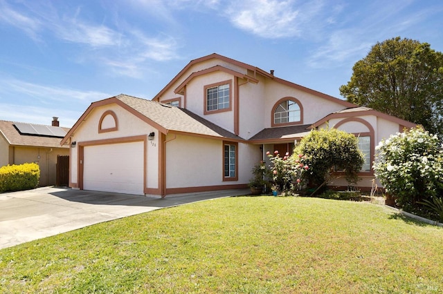 traditional-style home with stucco siding, a front lawn, driveway, and an attached garage
