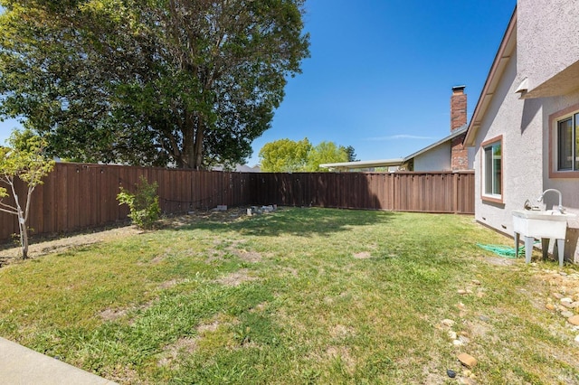 view of yard featuring a fenced backyard