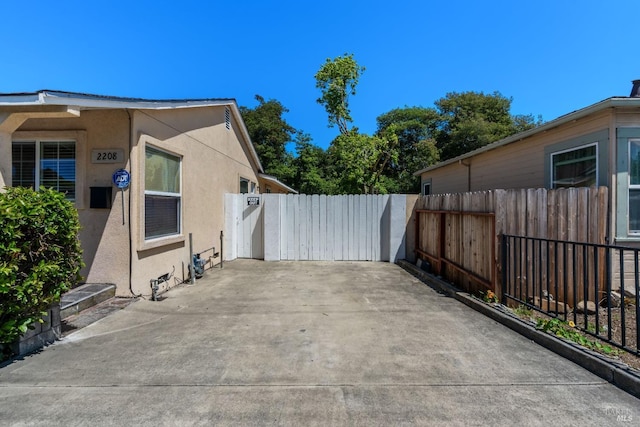 view of patio featuring fence