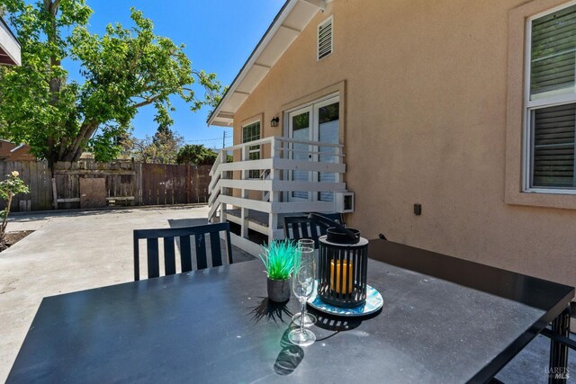 view of patio / terrace featuring outdoor dining space and fence