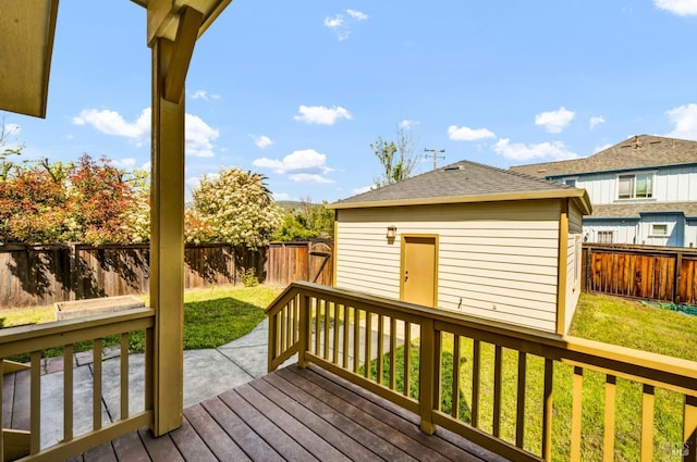 deck featuring a lawn, a patio area, and a fenced backyard