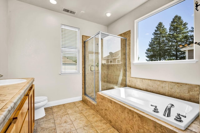 bathroom with vanity, baseboards, visible vents, a stall shower, and tiled tub