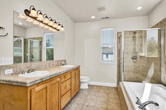 bathroom with double vanity, visible vents, a shower stall, and a sink