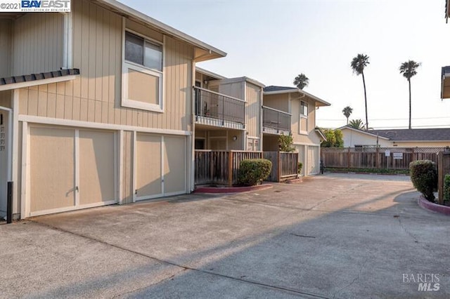 14375 Doolittle Dr, San Leandro, CA 94577 - view of property featuring concrete driveway and a garage