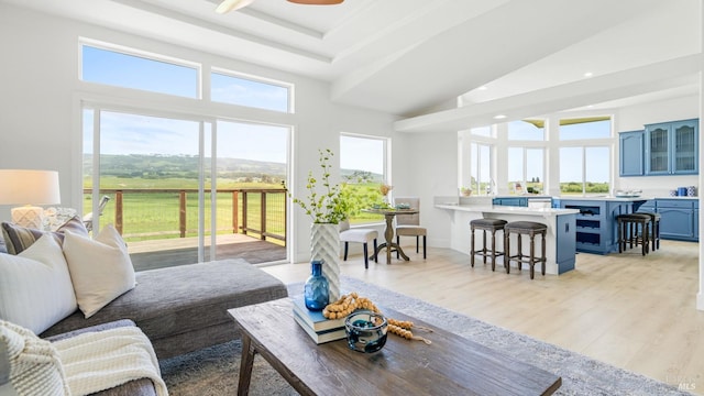 living area with recessed lighting, ceiling fan, and light wood-style floors