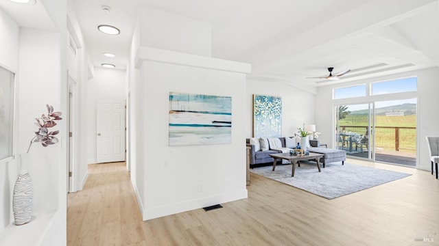 hall with baseboards, recessed lighting, and light wood-style flooring