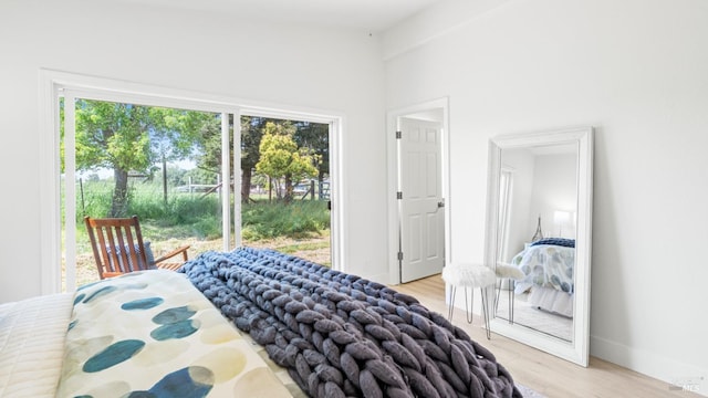 bedroom featuring baseboards and light wood-style floors