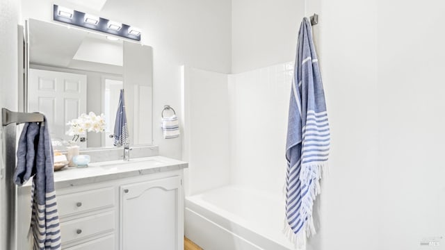 bathroom featuring shower / bathing tub combination and vanity
