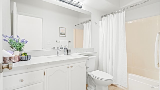 bathroom featuring shower / bath combo with shower curtain, toilet, and vanity