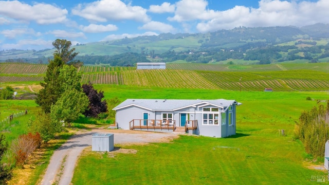 aerial view with a mountain view and a rural view