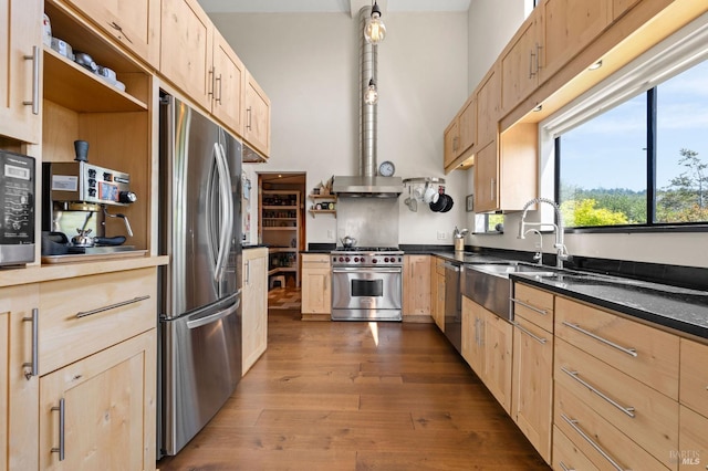 kitchen featuring light brown cabinetry, open shelves, and appliances with stainless steel finishes