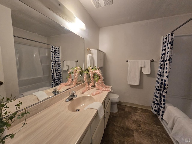 full bathroom featuring stone finish flooring, toilet, vanity, baseboards, and visible vents