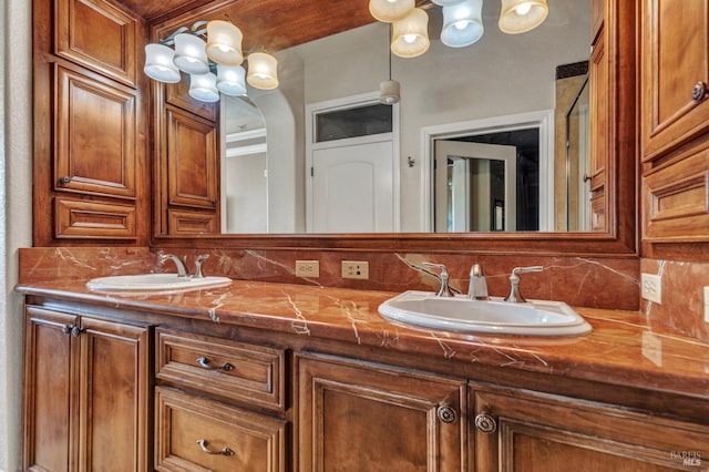 bathroom featuring double vanity, a sink, and backsplash