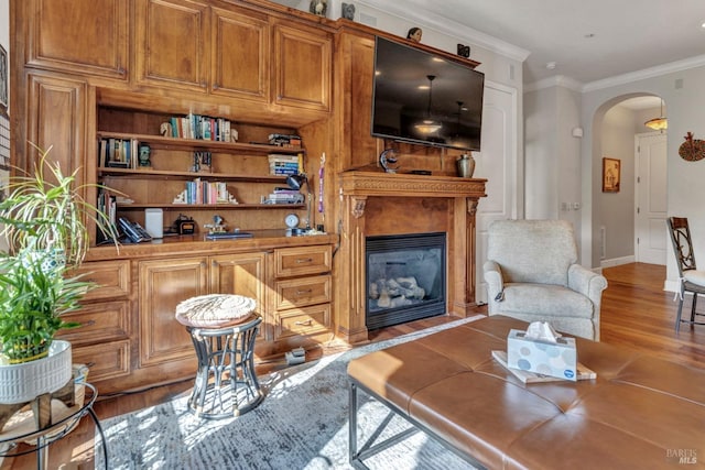 1112 Waltz Ct, Vallejo, CA 94591 - living room with arched walkways, a glass covered fireplace, wood finished floors, ornamental molding, and baseboards