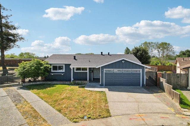 single story home featuring a front yard, board and batten siding, concrete driveway, an attached garage, and fence