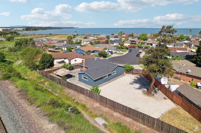 birds eye view of property featuring a residential view and a water view