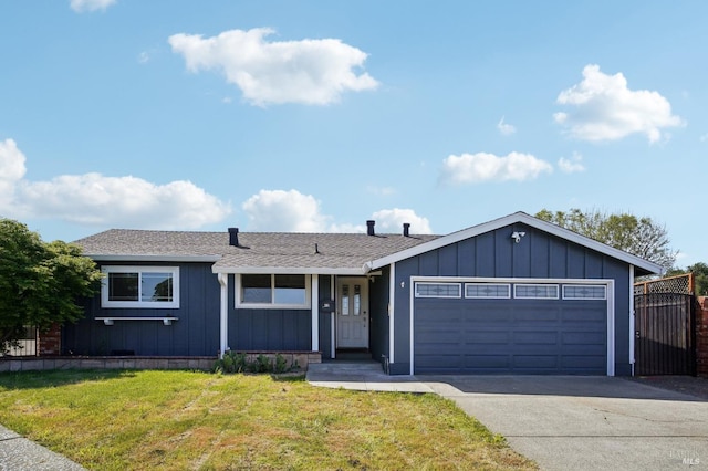 ranch-style house with concrete driveway, board and batten siding, roof with shingles, a front yard, and a garage
