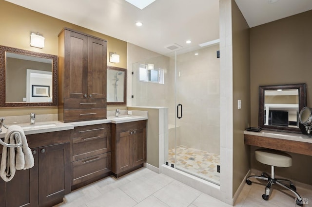 full bathroom with recessed lighting, tile patterned floors, double vanity, a sink, and a stall shower