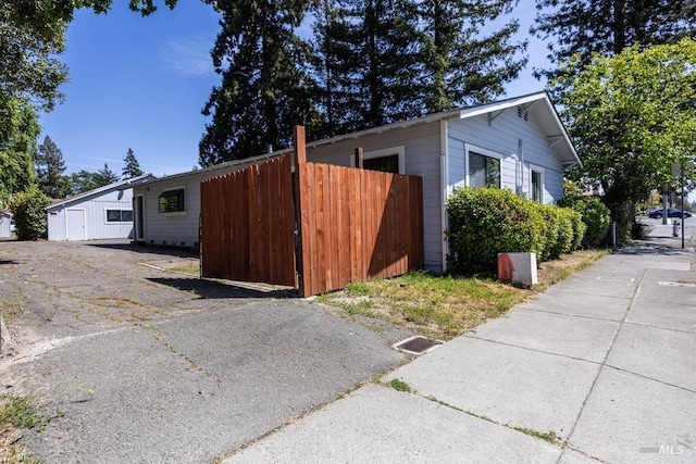 view of property exterior featuring fence