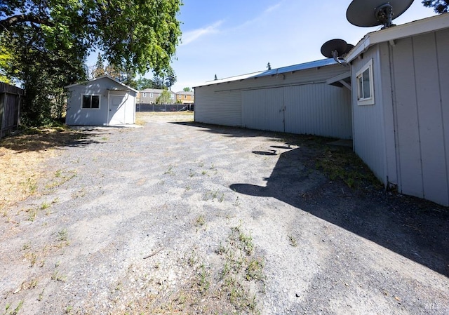view of yard featuring a shed and an outbuilding