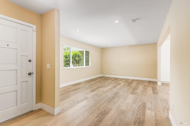 interior space featuring recessed lighting, light wood-style flooring, and baseboards