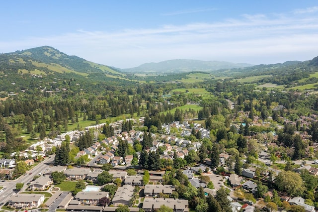 birds eye view of property featuring a residential view, a mountain view, and a forest view