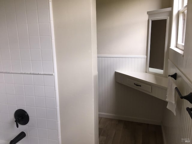 bathroom featuring wainscoting and wood finished floors