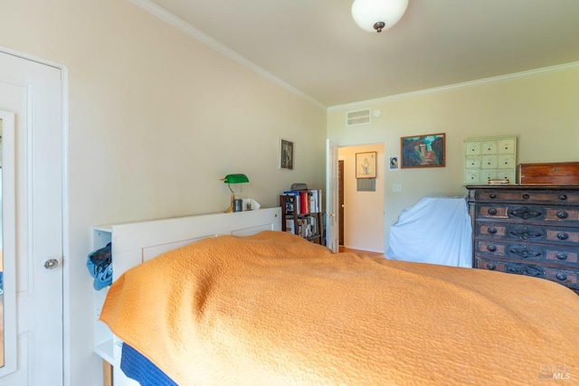 bedroom featuring ornamental molding and visible vents