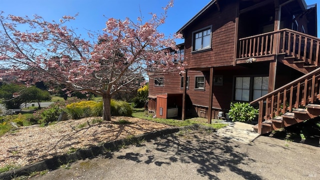 back of property with stairway